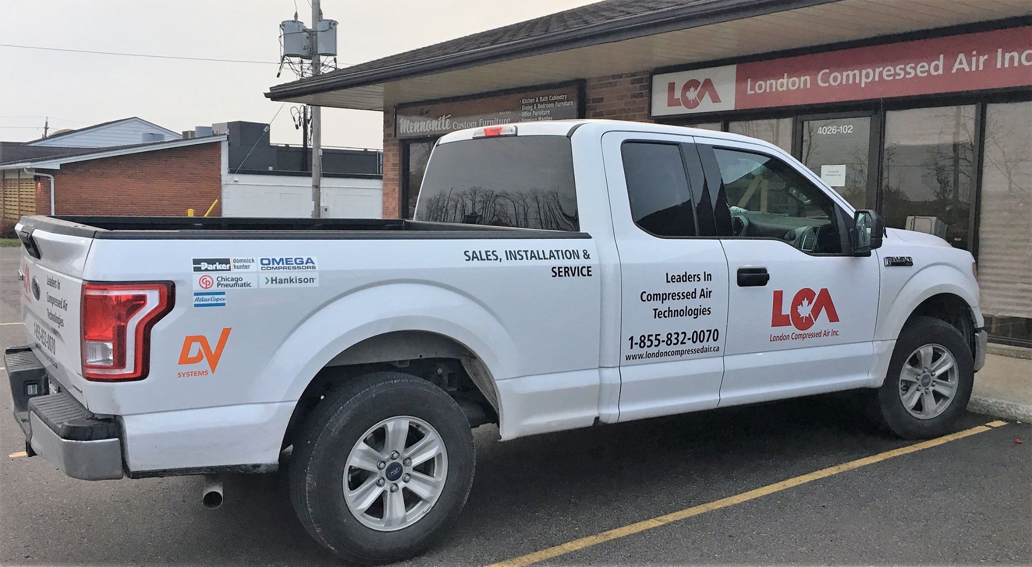 Front of the London Compressed Air Inc. office with the LCA pickup in foreground..